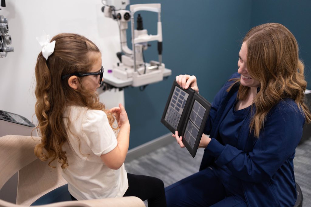 MVS pediatric optometrist with child in eye exam