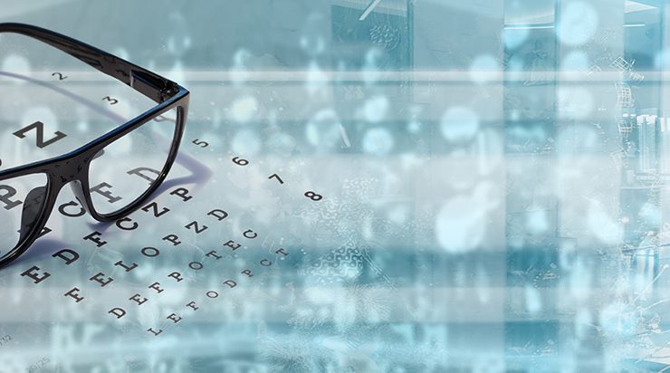 picture of glasses on eye chart and technology to correct refractive errors