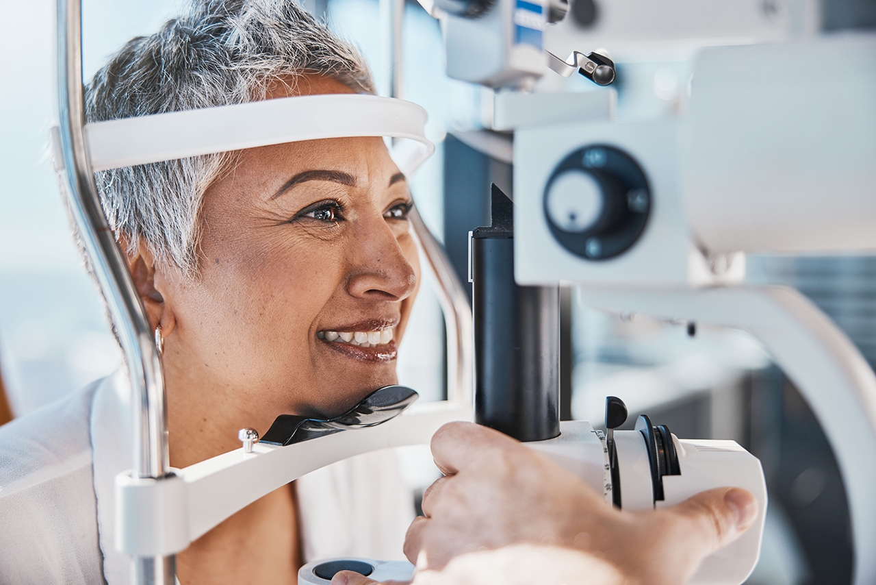 Female patient with vision insurance getting an eye exam