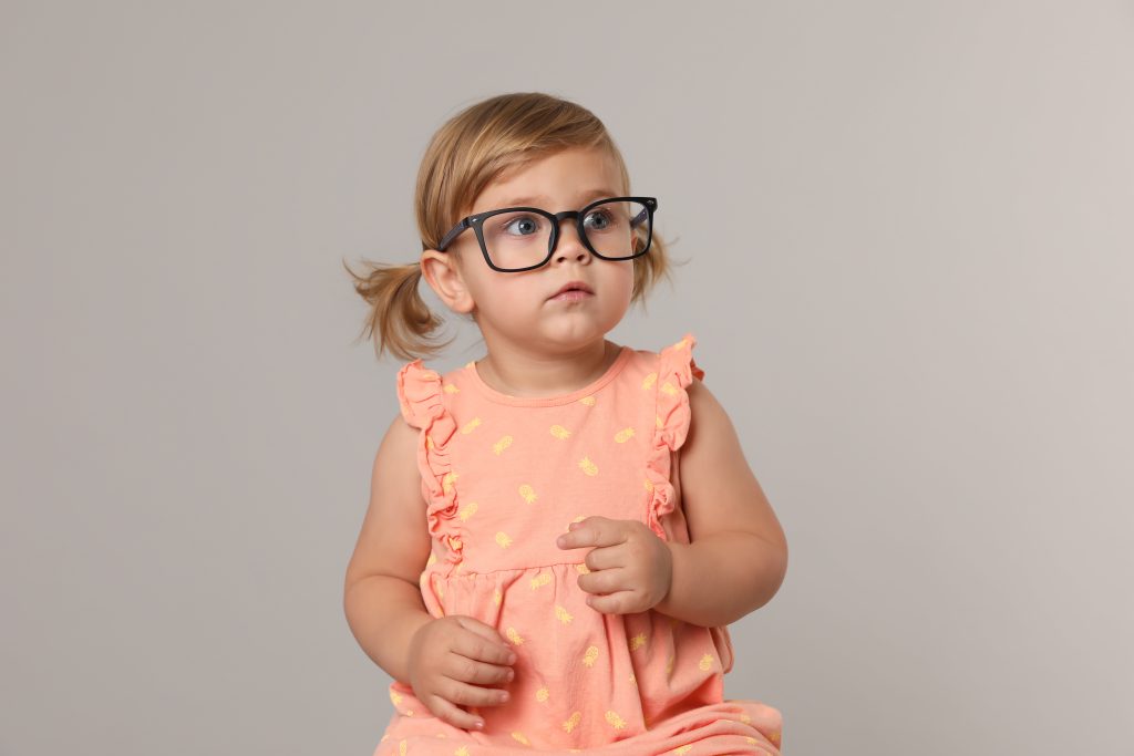 Young girl with childhood myopia wearing glasses